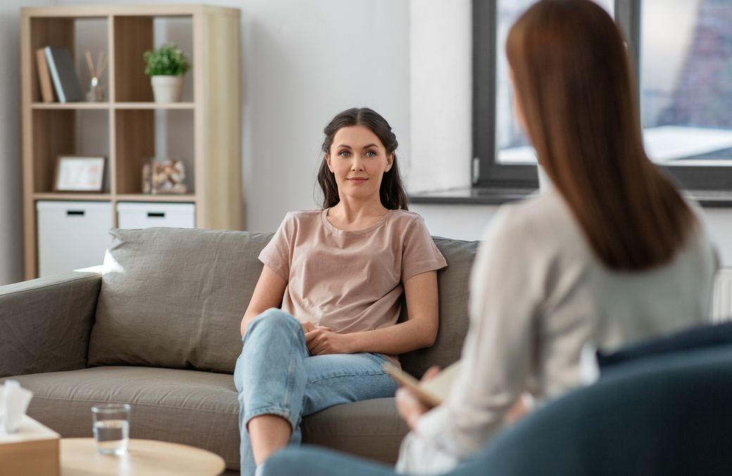 Woman and Psychologist at Psychotherapy Session